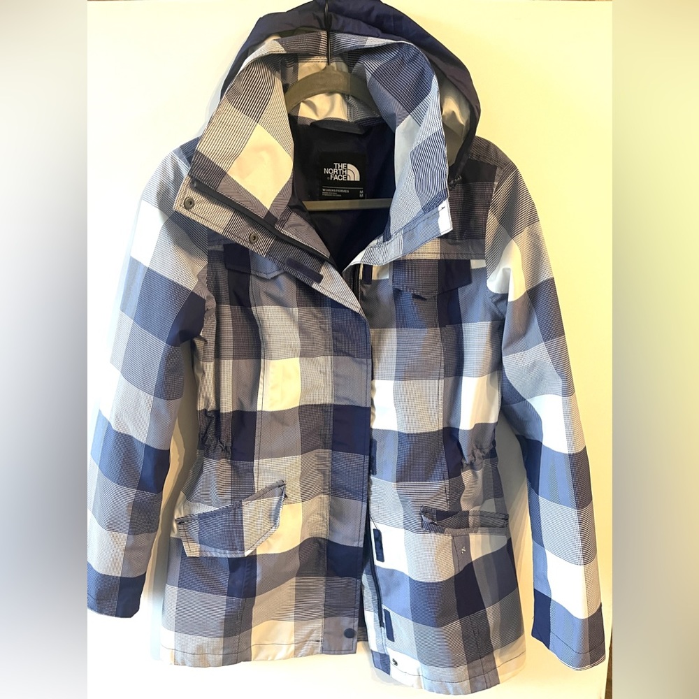 Blue and white checkered The North Face rain coat, women’s size medium